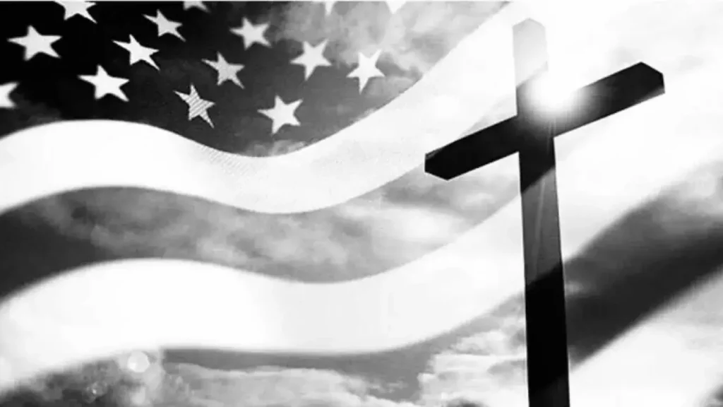 The American flag and a cross on a sunny day.