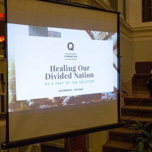 Close-up of "Healing Our Divided Nation" slide from a Powerpoint by QCommons.