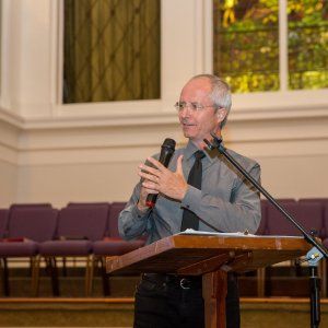 A man addressing attendees at a church-hosted social justice event in New Orleans.