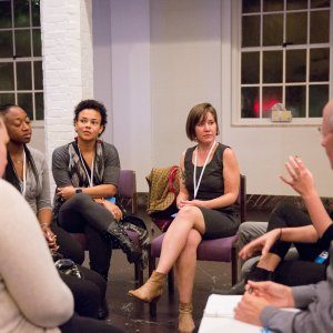 People having a round table discussion about race at a church-hosted event.