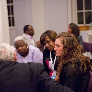 Six people of different races discussing the speech they just heard about racial reconcilation.