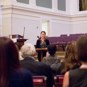 Close-up of an advocate speaking about racial reconciliation at a church-hosted event.