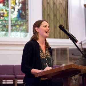 An advocate smiling during her speech at our church-hosted QCommons event in New Orleans.